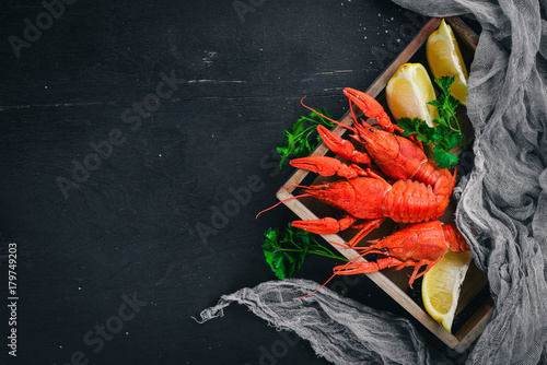Lobster. Seafood. On a wooden background. Top view. Free space for your text.
