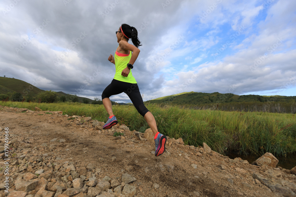 young trail runner woman running on sunset forest young trail runner woman running on sunset forest
