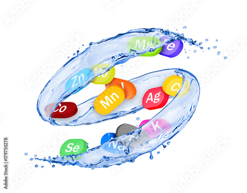 Group of chemical minerals and microelements in the form of pills moves in water splashes