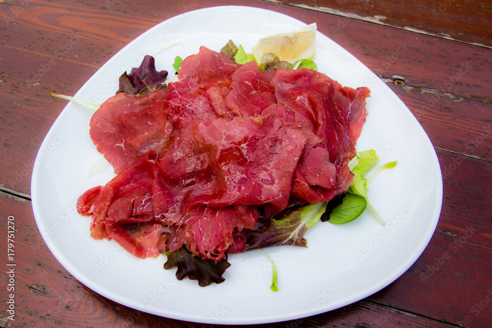 Carpaccio: italian dish of slices of raw beef