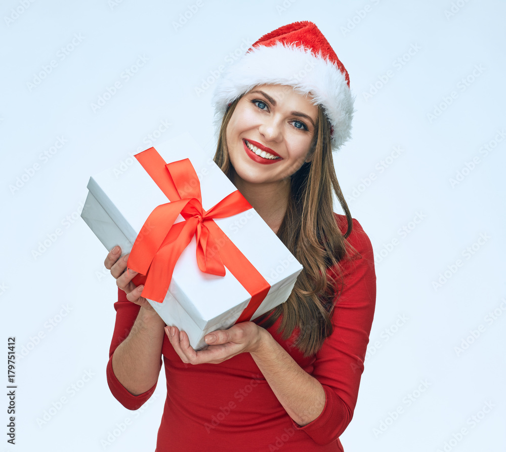 Smiling Santa girl holding gift box. Smiling Santa girl holding gift box.