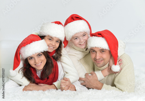 happy family in Santa hats 