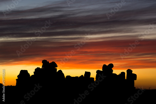 Boulder silhouette and colorful sunset