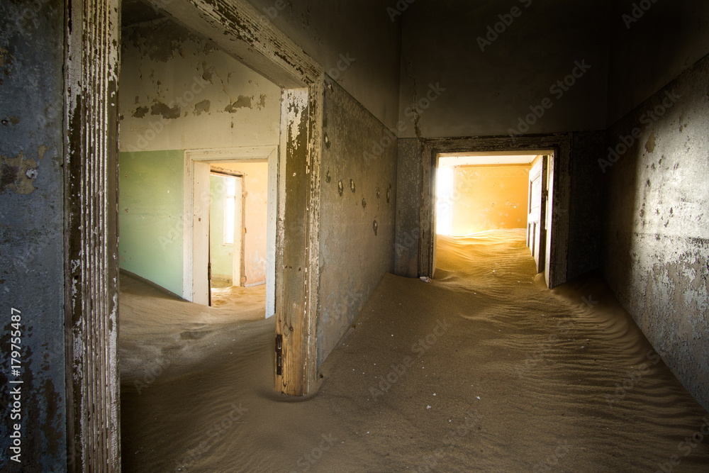 Abandoned house and sand