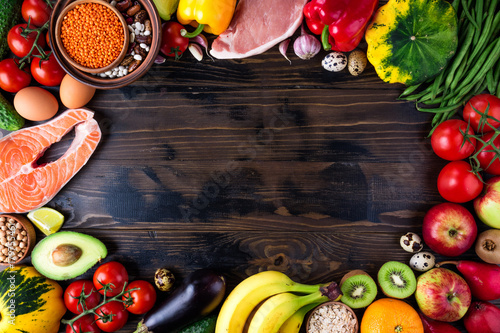 Background healthy food. Fresh vegetables, fruits, meat and fish on wooden table. Healthy food, diet and healthy life concept. Top view, copy space photo