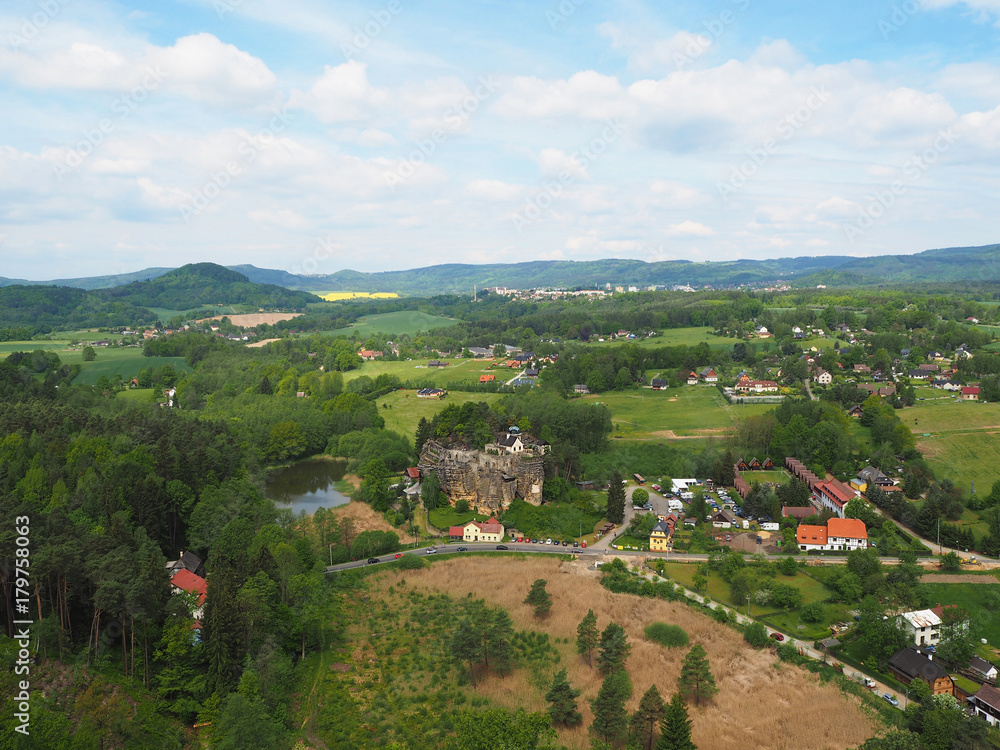 CZECH REPUBLIC, SLOUP V CECHACH, MAY 21,2016: View from lookout tower in the village sloup v cechach in luzické hory mountain with mediaval sand stone castle