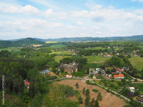 CZECH REPUBLIC, SLOUP V CECHACH, MAY 21,2016: View from lookout tower in the village sloup v cechach in luzické hory mountain with mediaval sand stone castle photo