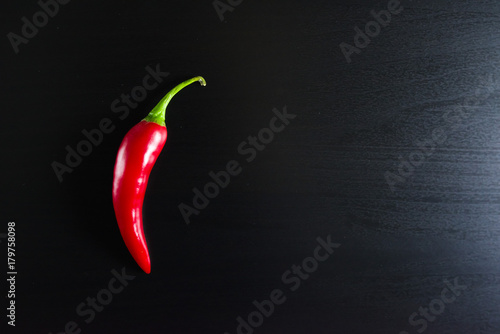 Chilli pepper on black background.
