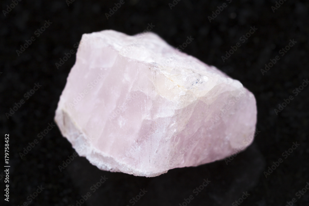 raw morganite (pink beryl) crystal on dark