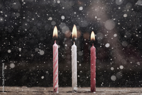 Artwork in retro style, burning candles, snow
