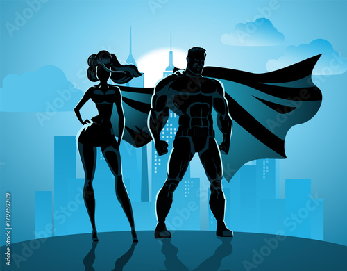 Superhero Couple: Male and female superheroes, posing in front of a light