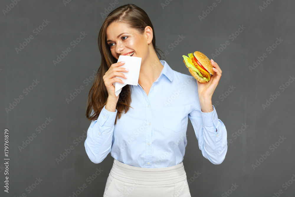 woman eating burger use paper tissue. woman eating burger use paper tissue.