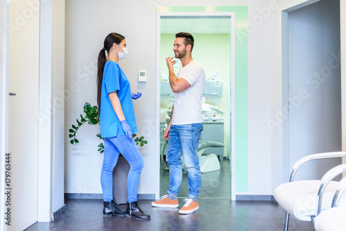 A Dentist discussing the treatment with a patient in the Dental 