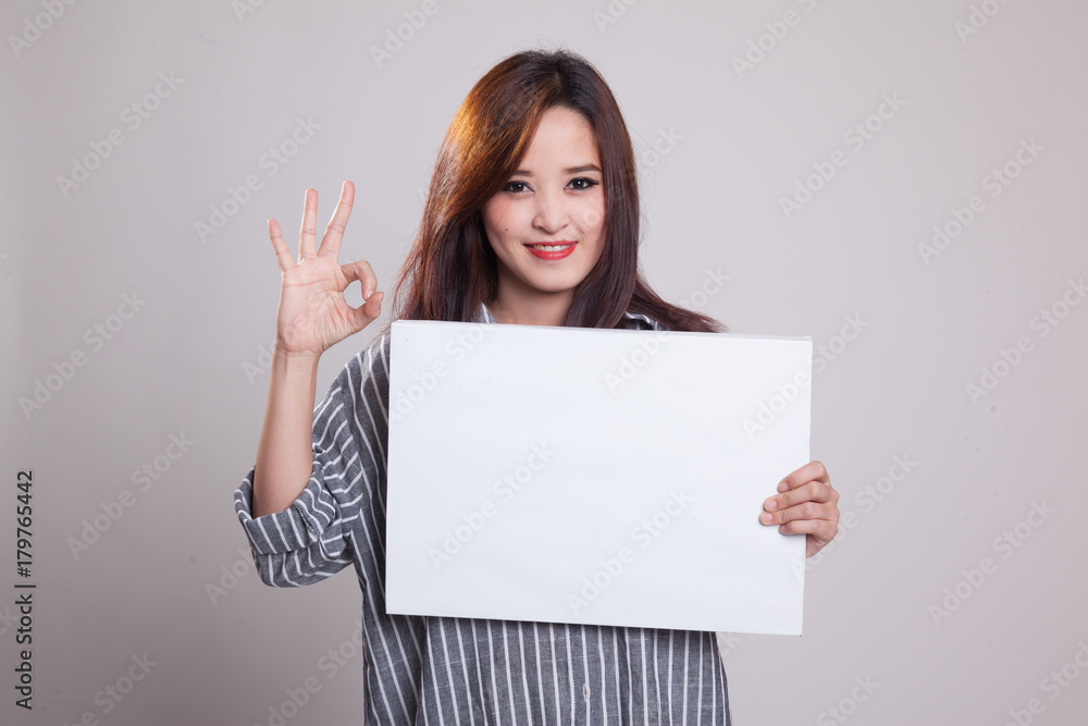 Young Asian woman show OK with white blank sign. Young Asian woman show OK with white blank sign.