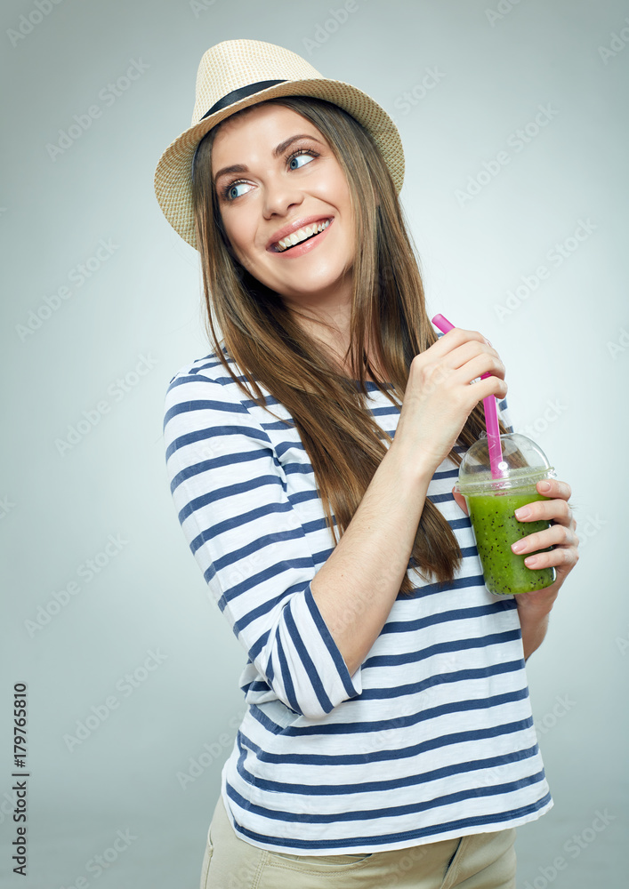 Happy woman holding glass with green juice. Happy woman holding glass with green juice.