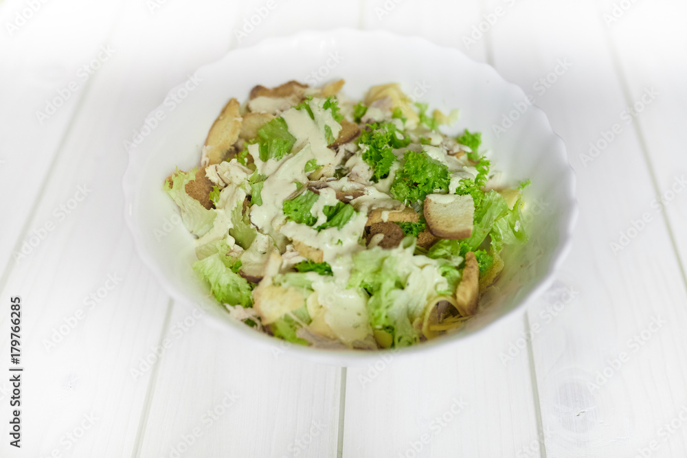 Mixed salad with green apple and walnuts on the table Mixed salad with green apple and walnuts on the table
