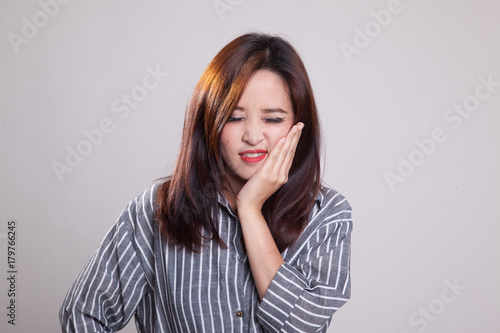 Young Asian woman got toothache. © halfbottle