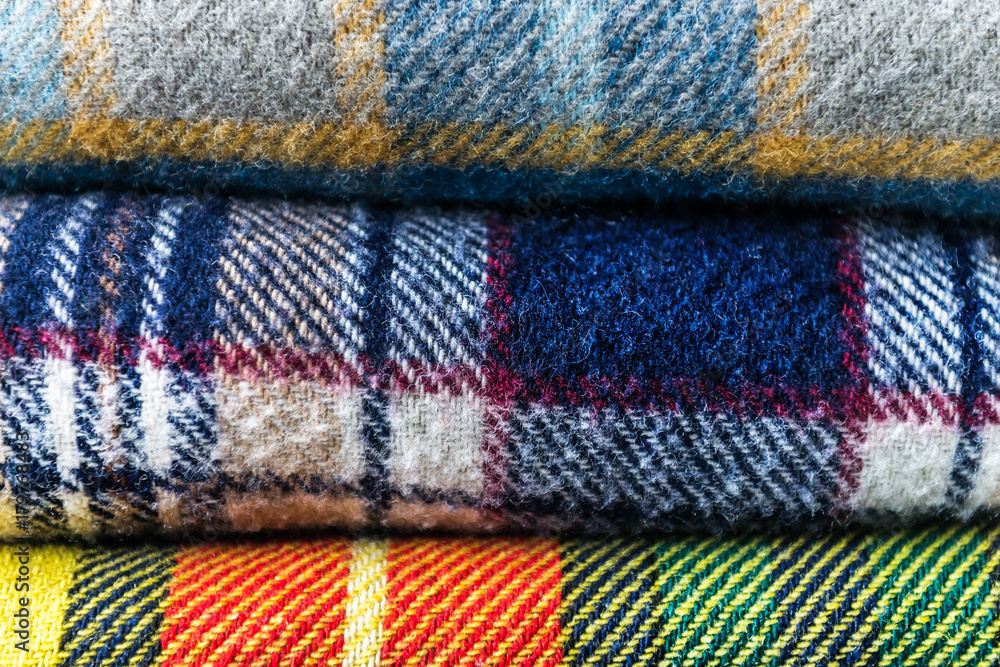 Stack of woolen checked blankets Stack of woolen checked blankets