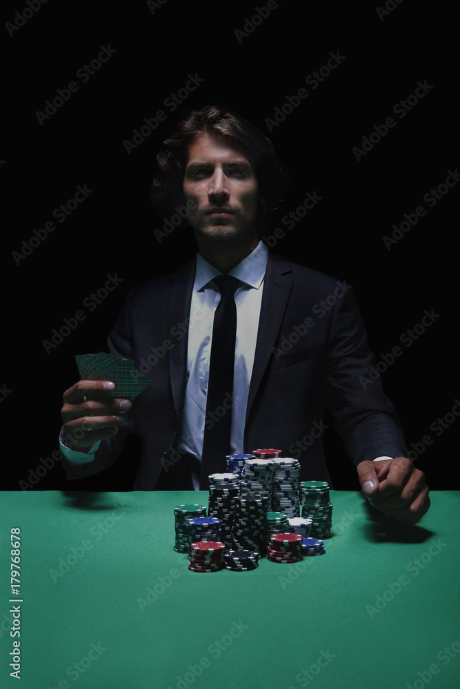 Young lucky gambler with cards and chips. Young lucky gambler with cards and chips.