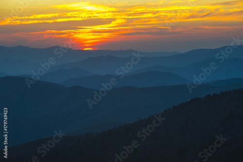 Spectacular Sunset in Smoky Mountains with Blue Ridge hills layered to the horizon with orange red sky