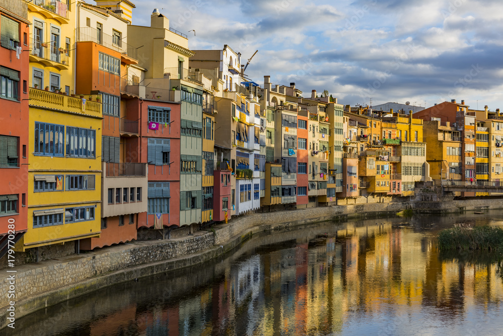 Colorful houses on the banks of the Onyar river in Girona Colorful houses on the banks of the Onyar river in Girona