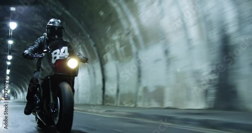 Motorcycle in tunnel, tracking shot