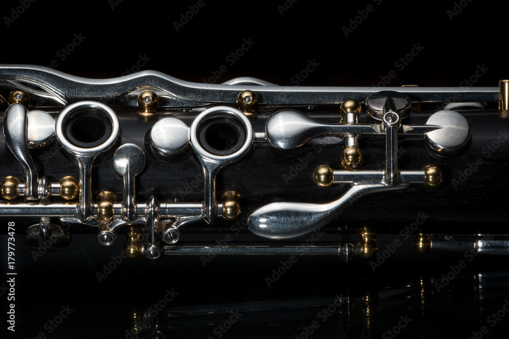 Fototapeta premium Details of a clarinet with silver keys and golden sockets