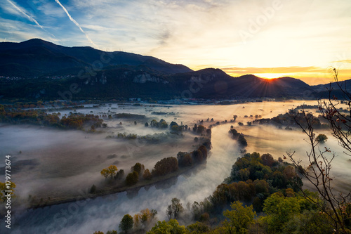 View of the Adda river valley during a foggy morning, Airuno, Italy © afinocchiaro