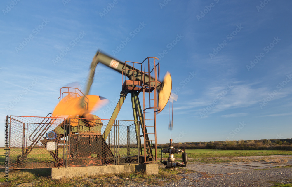 Operating oil pump, blurred moving parts