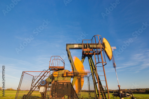 Wallpaper Mural Operating oil pump, blurred moving parts Torontodigital.ca