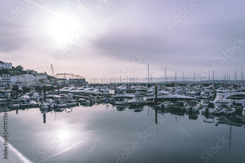 Torquay Harbor with calm reflections in the water