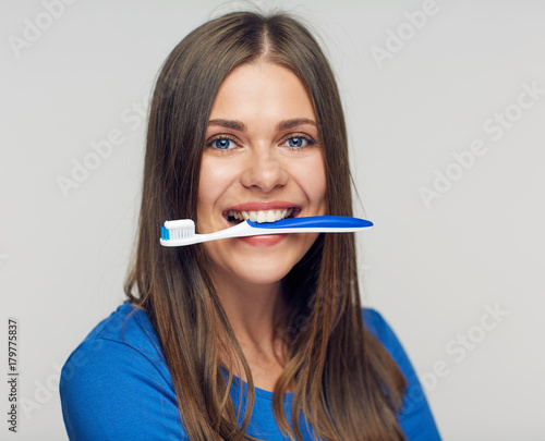 Close up portrait young woman with toothy brush.