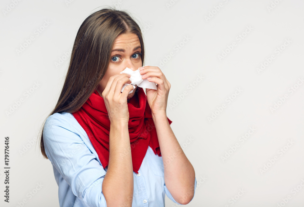 Sickness woman blowing his nose in paper tissue. Sickness woman blowing his nose in paper tissue.