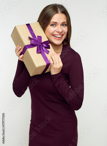 Happy woman holding gift box.