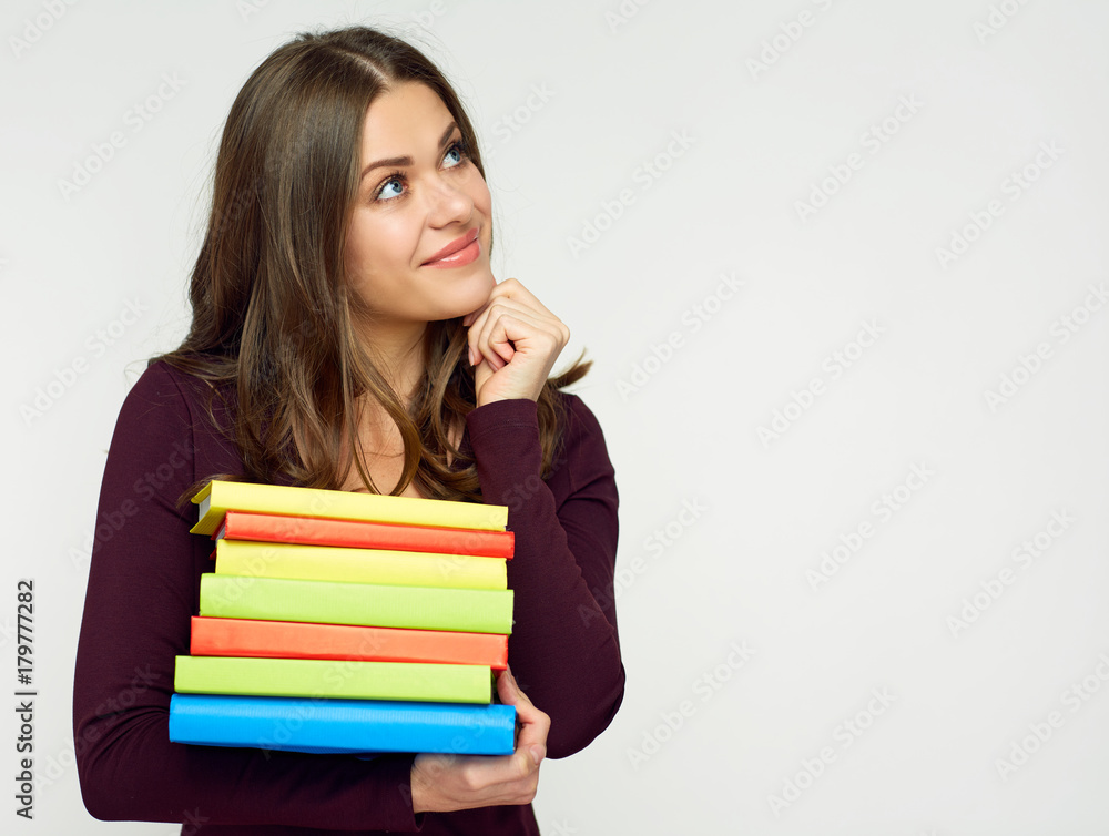 Close up portrait of student girl with books pile. Close up portrait of student girl with books pile.