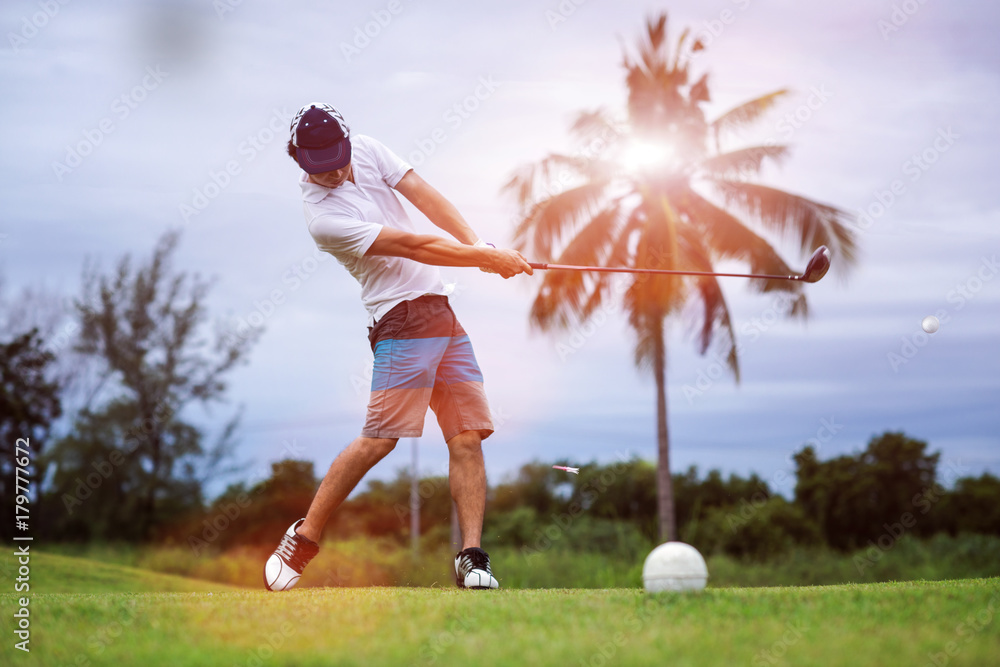 Fluffing of golf ball and tee flying away from the teeing ground impact