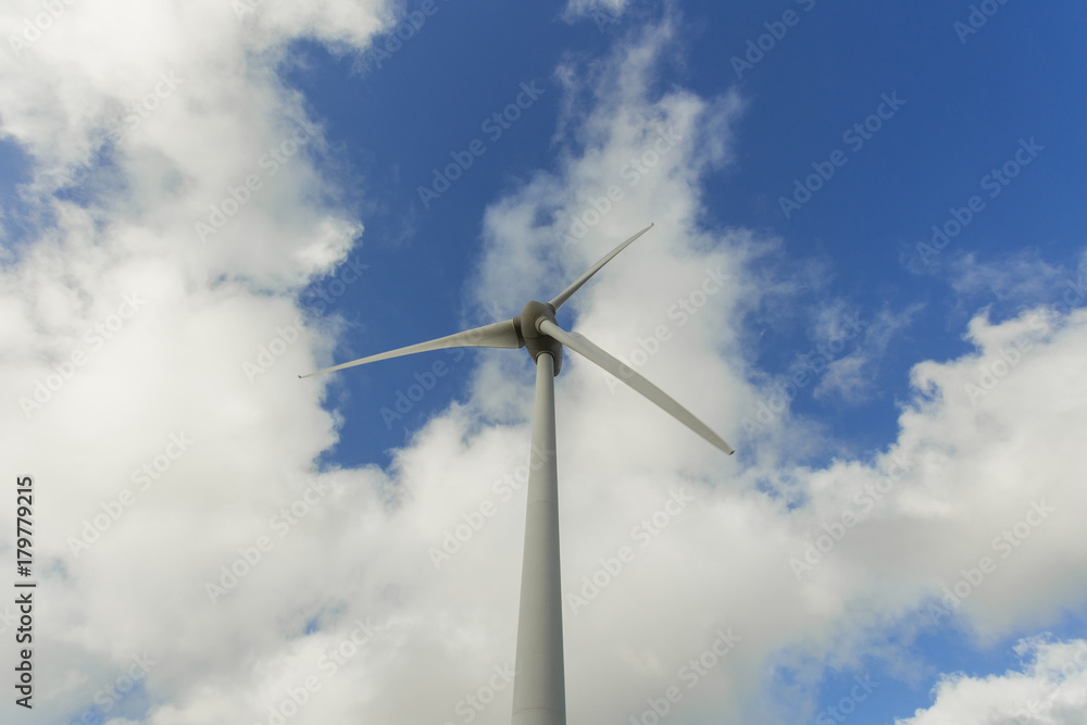 Wind turbines of a power plant for electricity generation in Normandy, France. Concept of renewable sources of energy. Environmentally friendly electricity production. Toned Wind turbines of a power plant for electricity generation in Normandy, France. Concept of renewable sources of energy. Environmentally friendly electricity production. Toned