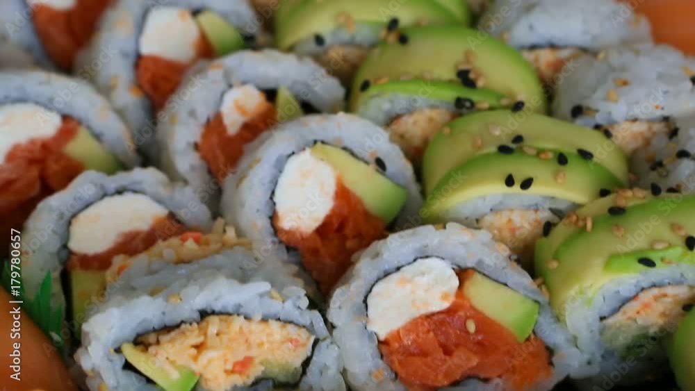 High definition video panning of a platter of delicious and fresh sushi rolls prepared with both raw and cooked ingredients 1080p HD High definition video panning of a platter of delicious and fresh sushi rolls prepared with both raw and cooked ingredients 1080p HD