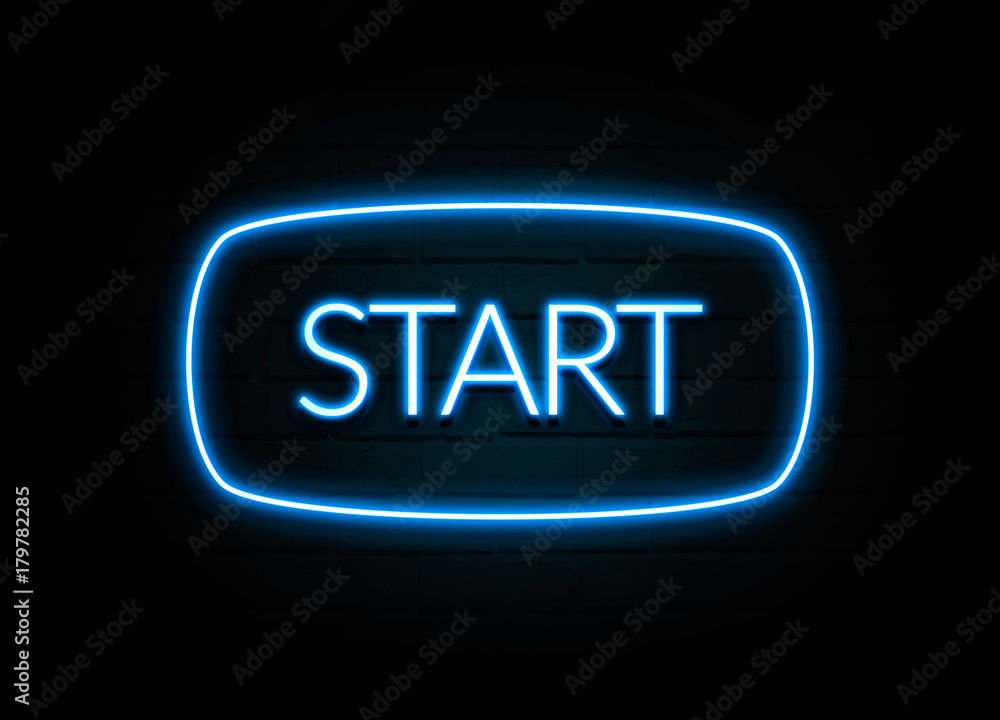 Start - colorful Neon Sign on brickwall Start - colorful Neon Sign on brickwall