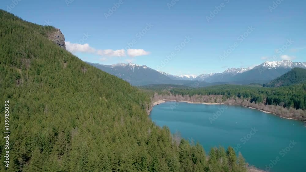 Cascade Mountain Range Dusted with Snow in Aerial Flying Over Turquoise Lake Cascade Mountain Range Dusted with Snow in Aerial Flying Over Turquoise Lake
