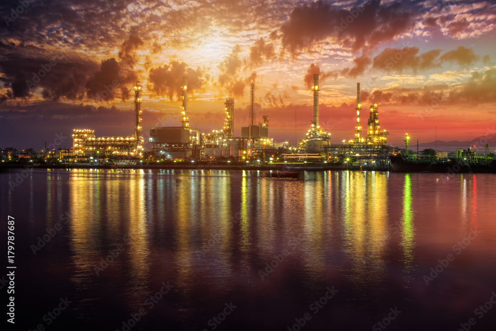 Fototapeta premium Oil and gas industry - refinery at Sunrise - factory - petrochemical plant with reflection over the river