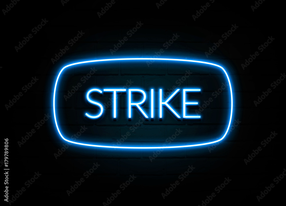 Strike - colorful Neon Sign on brickwall Strike - colorful Neon Sign on brickwall
