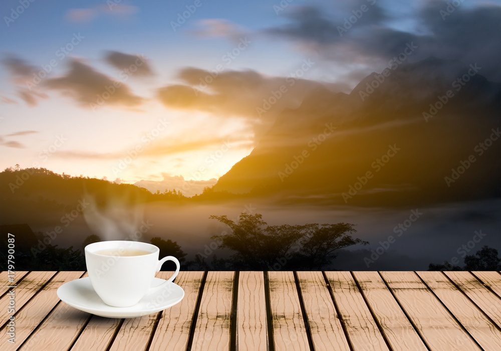 Cup of tea on wooden table on the viewpoint mountain landscape twilight time on the morning Cup of tea on wooden table on the viewpoint mountain landscape twilight time on the morning