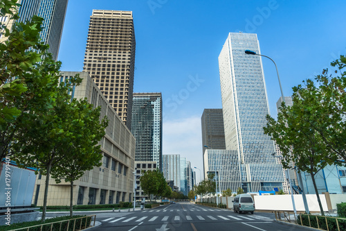 city road through modern buildings in beijing. © hallojulie