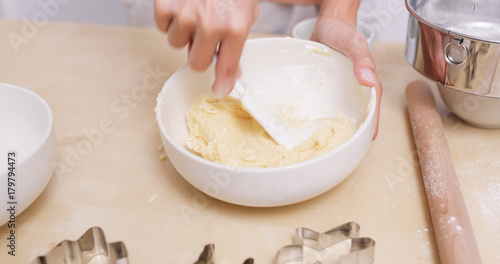 Mixing dough in bowl for making cookies