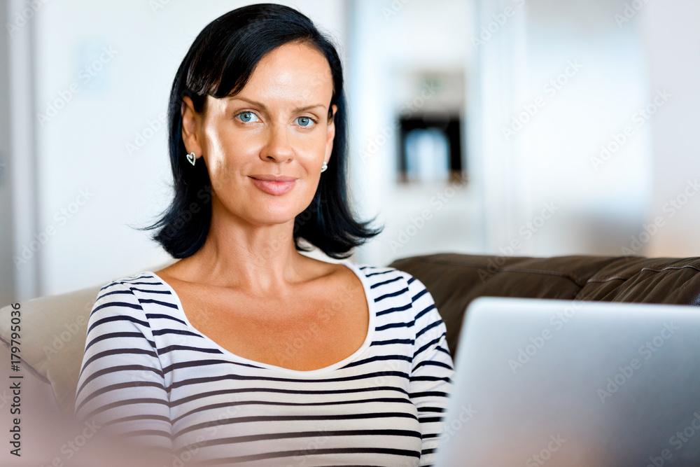 Beautiful woman working on her laptop Beautiful woman working on her laptop
