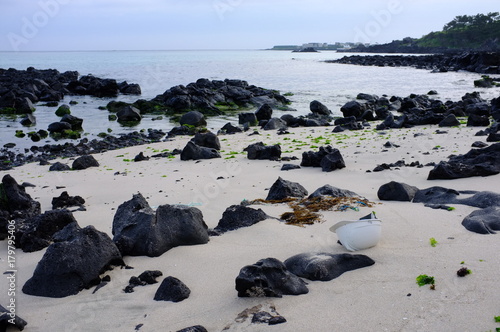 Worker's Helmet on a Rocky Beach