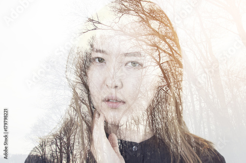 Fototapeta Naklejka Na Ścianę i Meble -  Portrait of a young woman with the effect of double exposure, nature style