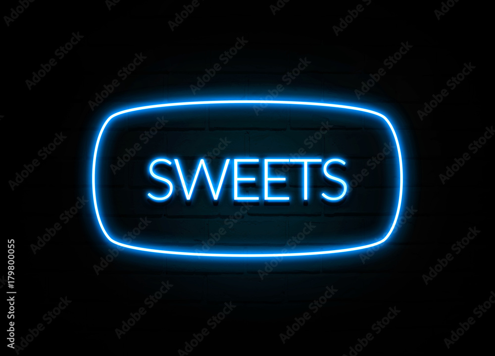 Sweets - colorful Neon Sign on brickwall Sweets - colorful Neon Sign on brickwall