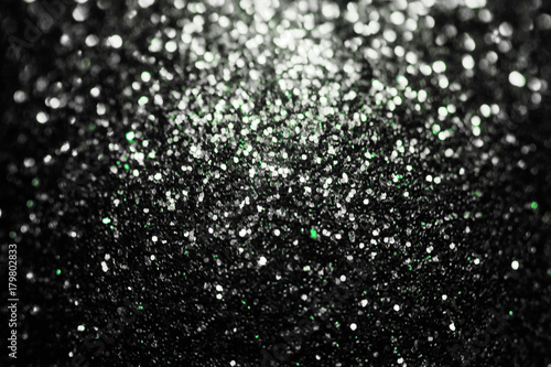 Black glitter sparkle background. Black friday shiny pattern with sequins. Christmas glamour luxury pattern, black christmas and glitter diamond background. Dark silver pattern.